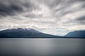 View of the cloud-covered Osorno volcano, Llanquihue Lake, Region de los Lagos, Chile, South America