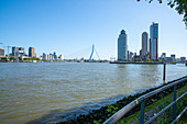 View over the New Meuse to the new district of Kop van Zuid. With the buildings World Port Center, Hotel New York and the Montevideo Tower. Rotterdam, The Netherlands, June 2020