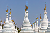 White stupas at famous golden Kuthodaw pagoda in Mandalay, Myanmar