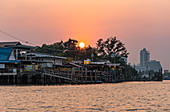 Sunset over Prapadaeng from the boat, Bangkok, Thailand