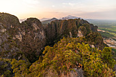 Sunset over karst rock landscape, Tiger Cave Mountain, Tiger Cave Temple, Krabi Town, Thailand