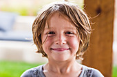 5 year old boy smiling at camera