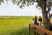 mother and kids at tented camp, Botswana