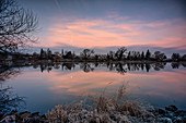 Full moon over Segnitz am Main at sunrise, Kitzingen, Lower Franconia, Franconia, Bavaria, Germany