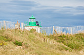 The lighthouse at Pointe de Saire above the dunes at Saint Vaast la Hougue, Cotentin Peninsula, Normandy, France