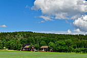 Large farm with red houses by the forest, near Leksand, Dalarna province, Sweden