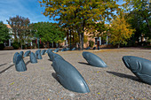 Street scene with art work (fish sculptures) in downtown Santa Fe, New Mexico, USA.