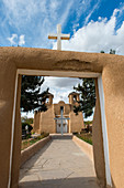 The San Francisco de Assisi Mission Church in Ranchos de Taos, New Mexico, USA, was completed in 1816 is a sculpted Spanish Colonial church with massive adobe buttresses and two front-facing bell towers.
