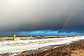 Dazendorf beach with a view of the steep coast, rainbow and kiter, Baltic Sea, East Holstein, Schleswig-Holstein, Germany