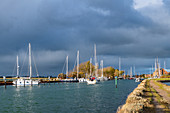 Harbor entrance with sailing boats in Ohrt on Fehmarn,