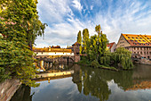 View from Maxbrücke to the Pegnitz (river) and the Henker's Bridge in the evening light, Nuremberg city center, Franconia, Bavaria, Germany