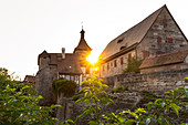 Sunset over entrance to Cadolzburg Castle on Burggraben, Cadolzburg, Franconia, Bavaria, Germany