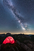Camping under the Milky Way on a summit in the Austrian Alps