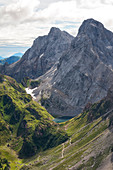 Volaia Lake, whit Coglians and Lastrons del Lago mountains on the background, seen from the summit of Volaia Mount. Carnic Alps, Volaia Mounts group, Forni Avoltri, Udine province, Friuli Venezia Giulia, Italy.