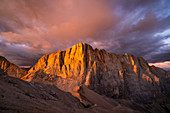 Marmolada south face at sunset from Ombretta mount during summer. Canazei, Contrin valley, Fassa valley, Trento district, Dolomites, Trentino Alto Adige, Italy, Europe.
