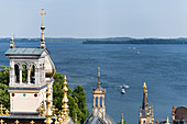On the roofs of Schwerin Castle surrounded by towers, domes, chimneys - view to Schwerin Lake, Mecklenburg-Western Pomerania, Germany