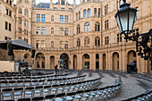 Chairs stand for an upcoming event in the courtyard of Schwerin Castle, Mecklenburg-Western Pomerania, Germany