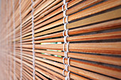 Tropical bamboo wood blinds on window. Abstract background and texture