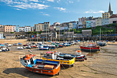 Boats grounded in harbour, Tenby, Pembrokshire, West Wales, Wales, UK