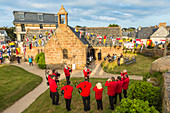 Ploumanach, Cote de Granit Rose, Cotes d'Amor, Brittany, France. Pipers performing near the chapel of Saint Guirec.