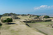 View of the three meter-deep Sunken Patio, or Patio Hundido, on the North Platform of Monte Alban (UNESCO World Heritage Site), a large pre-Columbian archaeological site in the Valley of Oaxaca region, Oaxaca, Mexico with the Grand Plaza and the South Platform in the background.