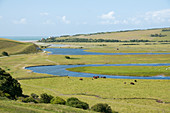 Cuckmere Haven with river and valley and view of the sea far away, East Sussex, United Kingdom