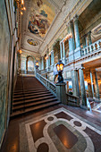 Ancient columns and frescoes on ceiling in the interior hall of the Royal Palace, Stockholm, Sweden