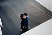 Couple in business suits kissing