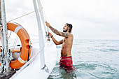 Man preparing sailboat