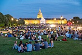 France, Paris, Esplanade des Invalides, picnic on summer evenings and the Hotel des Invalides in the background