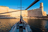 France, Bouches du Rhone, Marseille, Vieux Port, sailboat at anchor and Fort Saint Jean