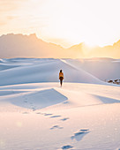 Woman on white sand dunes,White Sands National Monument,New Mexico,US