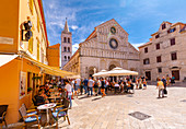 View of busy restaurant and Cathedral of St. Anastasia, Zadar, Zadar county, Dalmatia region, Croatia, Europe