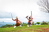 Caci men perform a traditional whip dance with bamboo shields and leather whips, western Flores, Indonesia, Southeast Asia, Asia