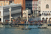Elevated view of a busy St. Mark's Square in Venice during high tide with gondolas lined up along the shore, Venice, UNESCO World Heritage Site, Veneto, Italy, Europe