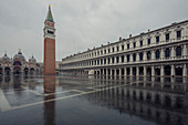 Looking across a flooded and deserted St. Mark's Square to the Campanile and Basilica during high tide, Venice, UNESCO World Heritage Site, Veneto, Italy, Europe