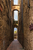 In the alleys of San Gimignano, Province of Siena, Tuscany, Italy