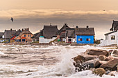 View of the houses of the Graswarder in Heiligenhafen during a north-east storm, Baltic Sea, Ostholstein, Schleswig-Holstein, Germany