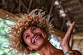 Happy Tahitian woman during an immersion workshop in the ELK cultural village, Apootaata, Moorea, Windward Islands, French Polynesia, South Pacific
