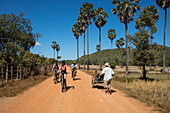 Bicycle excursion through rice fields for guests of the river cruise ship, near Andong Russei, Kampong Chhnang, Cambodia, Asia