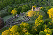 Aerial image showing the ruins of Okehampton Castle on a spring morning, Okehampton, Devon, England, United Kingdom, Europe