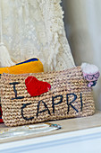 Close-up of a shop window with I-love-Capri-bag in Capri, Italy