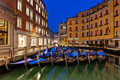 Resting gondolas at Bacino Orseolo in Venice before sunrise, Veneto, Italy