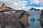 LANDSCAPE WITH A BLUE-COLORED GLACIER'S ICE TONGUE, ASTORIA CRUISE SHIP, PRINCE CHRISTIAN SOUND, GREENLAND