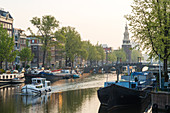 The Oudeschans canal in Amsterdam with the Montelbaanstoren tower in the background, Amsterdam, Holland, Netherlands