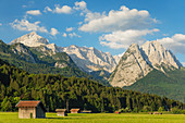Hay barns at Hammersbach Footpath against Wetterstein Mountain Range, Garmisch-Partenkirchen, Werdenfelser Land, Upper Bavaria, Germany, Europe