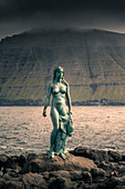 Statue of Kópakonan, mermaid in the village of Mikladalur on the island of Kalsoy, Faroe Islands