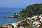 Holiday home settlement on Glyfada Beach (also Glifada Beach) is located a little north of the village of Pelekas at the foot of the steep west coast, Pelekas, Corfu Island, Ionian Islands, Greece