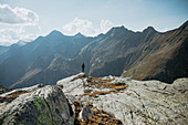 Female mountaineer in front of Swiss mountain massif, Switzerland, mountains, mountaineering,
