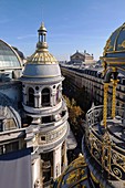 France, Paris, Boulevard Haussman, the gilded dome of the department store Le Printemps Haussmann and the Garnier Opera in the background